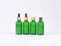 Preview: Grünglasflasche 50ml, mit Pipette gold